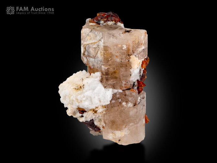 Apatite with etched spessartine garnet from Pakistan.