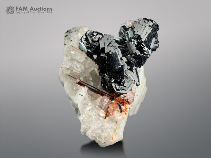 Hematite cluster with rutile & adularia on matrix from Pakistan.