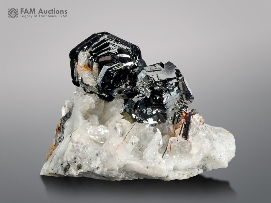 Hematite cluster with rutile & adularia on matrix from Pakistan.