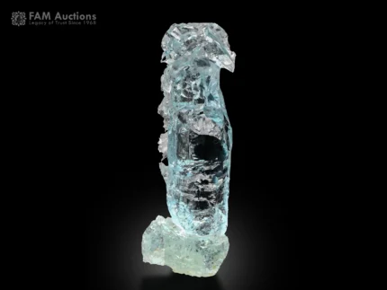 Deep blue etched aquamarine crystal from Shigar Valley, Pakistan, self-standing floater with high luster.