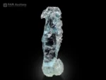 Deep blue etched aquamarine crystal from Shigar Valley, Pakistan, self-standing floater with high luster.