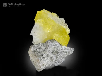 Vivid lemon-yellow brucite crystal perched on matrix from Qila Saifullah, Pakistan