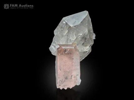 Quartz crystals with sharp, lustrous terminations alongside pale pink morganite, forming an elegant miniature specimen.
