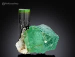 Natural green tourmaline crystal combined with fluorite and albite, a rare mineral specimen for collectors and display.