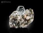 Transparent beryl var. goshenite crystal with apatite and muscovite matrix from Pakistan showing sharp crystal form and excellent clarity.
