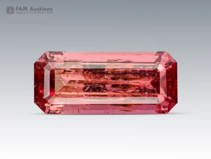 Emerald cut hot pink tourmaline gemstone from Afghanistan showing natural inclusions