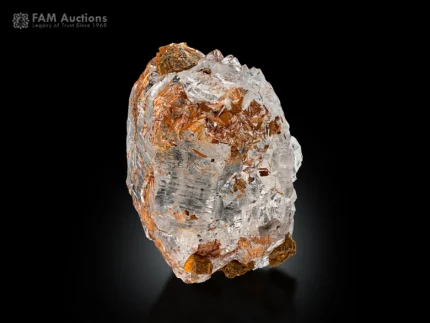 Quartz crystal with dense sagenite rutile inclusions showing clustered needle-like patterns inside clear quartz.