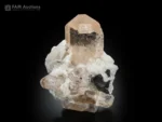 Image Alt Text: Natural topaz crystal on albite with schorl from Pakistan.