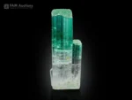 Gemmy bicolor tourmaline crystal showing green to pink color zoning with a side baby crystal.