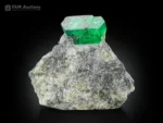 Vivid green emerald crystal on natural matrix mineral specimen
