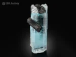 Gemmy blue aquamarine crystal with contrasting black schorl crystals.