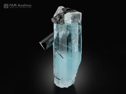 Gemmy blue aquamarine crystal with contrasting black schorl crystals.