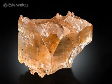 Topaz crystal with golden color and natural sculptural etching details.