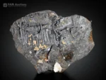 Hematite specimen with fine rutile needles and white albite crystals.