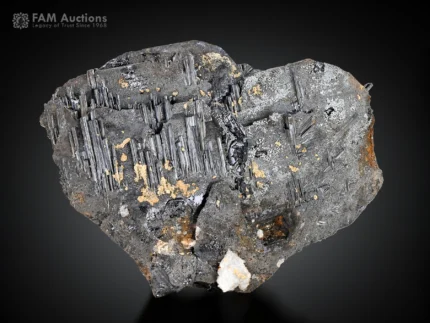 Hematite specimen with fine rutile needles and white albite crystals.