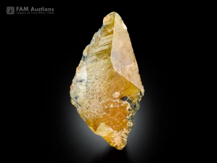 Lustrous honey colored titanite crystal with sharp wedge shaped form.