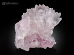 Soft pink rose quartz crystal cluster with sharp crystal growth.