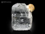 Clear quartz crystal with albite crystal attached