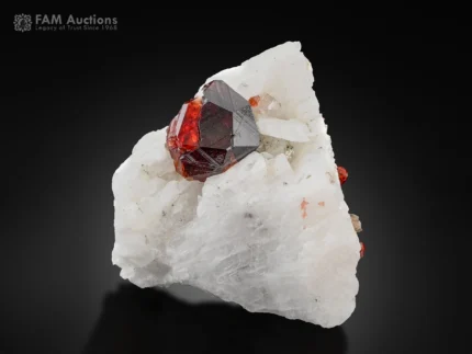 Blood red spessartine garnet crystal on white albite matrix from Shengus, Pakistan.