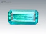 Natural 2.15 carat blue tourmaline emerald cut gemstone with ocean blue color and visible natural inclusions.