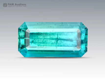 Natural 2.15 carat blue tourmaline emerald cut gemstone with ocean blue color and visible natural inclusions.