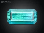 Natural 2.15 carat blue tourmaline emerald cut gemstone with ocean blue color and visible natural inclusions.