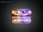 Natural 27.25 carat ametrine gemstone with pixel cut showing purple and golden color zoning and excellent clarity.