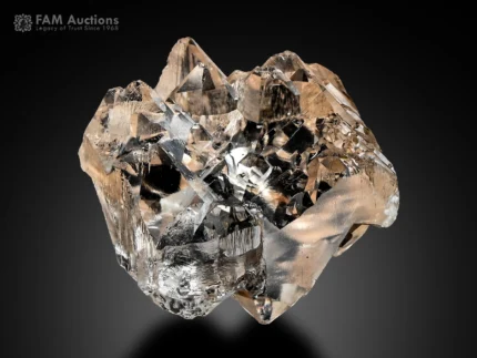 Etched topaz crystal from Pakistan with sharp termination and natural surface texture on dark background.