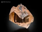 Champagne-colored, etched topaz crystal with a sharp form from Pakistan.