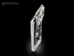 Transparent faden quartz crystal with elongated shape and visible internal faden line on dark background.