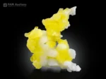 Bright lemon yellow brucite specimen with botryoidal formation and white crystalline contrast on a dark background.