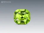 Natural 1.30 carat cushion-cut peridot gemstone from Pakistan with vivid apple green color and excellent luster.