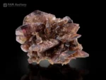 Natural Axinite crystal cluster with sharply terminated bladed crystals and vitreous luster.