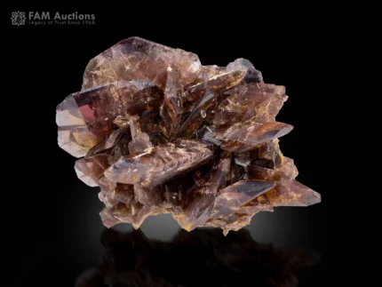 Natural Axinite crystal cluster with sharply terminated bladed crystals and vitreous luster.