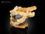 Sharp celestine crystals with sculptural calcite formation on matrix