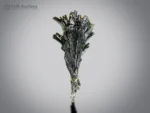 Dramatic epidote tree crystal formation with elongated lustrous crystals