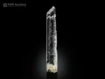 Elongated etched quartz crystal with sharp termination from Pakistan.