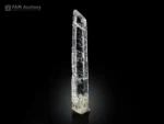Elongated etched quartz crystal with sharp termination from Pakistan.