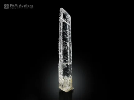 Elongated etched quartz crystal with sharp termination from Pakistan.