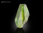 Green Titanite crystal with sharp termination on Albite matrix and chlorite spray