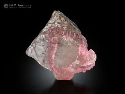 Pink rose quartz crystal formation on transparent quartz matrix.