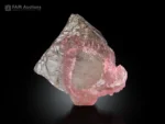 Pink rose quartz crystal formation on transparent quartz matrix.