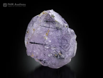 Purplish apatite crystal with black riebeckite inclusions from Pakistan.