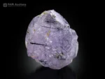 Purplish apatite crystal with black riebeckite inclusions from Pakistan.