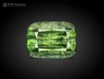 Natural green cushion-cut gemstone weighing 7 ct with distinctive Ludwigite inclusions