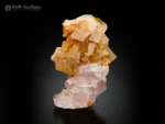 Pink apatite crystals associated with calcite display excellent contrast.