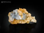 Pale blue celestine crystal cluster on contrasting calcite matrix.
