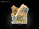 Pale blue celestine crystals on calcite matrix.