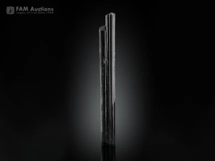 Elongated schorl crystal with sharp vertical striations and excellent luster