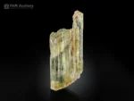 Transparent pale yellow-green triphane spodumene crystal with natural striations from Afghanistan.